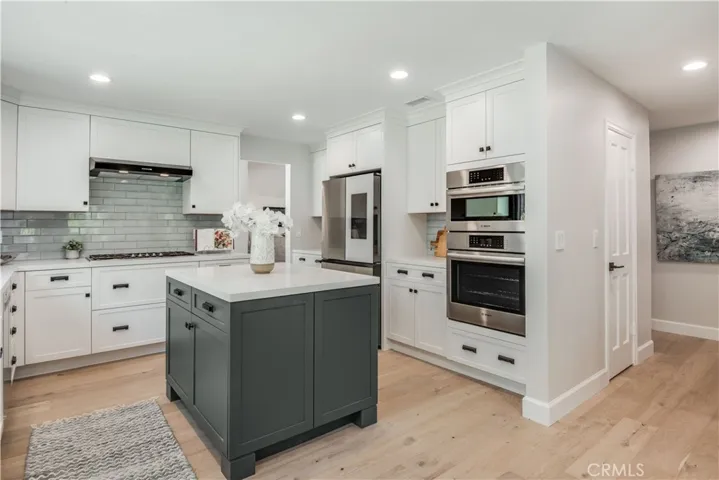 Specially selected appliances, convenient guest coat closet (across from walk-in pantry).