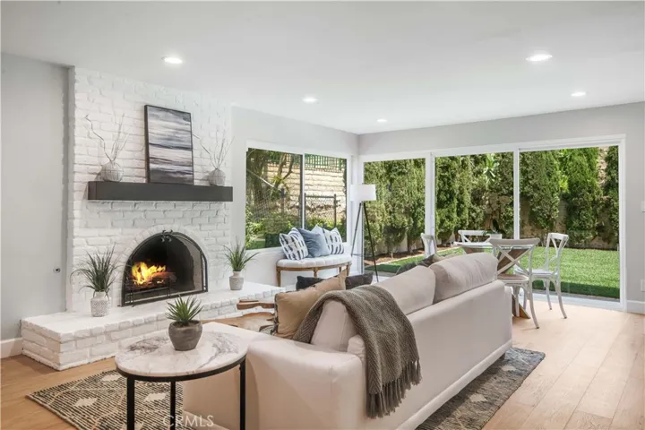 Great room opens to backyard. (photographer inserted fire for this photo)