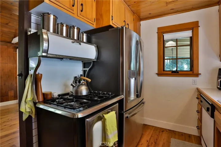 Kitchen with older gas oven.
