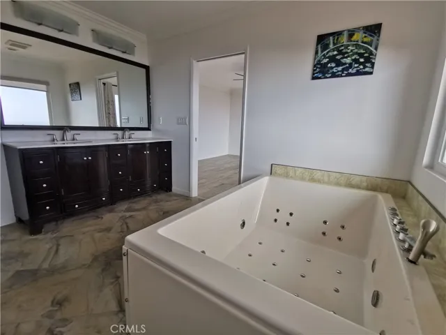 Bathroom in master bedroom view
