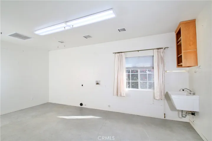 In back garage- permitted as "laundry room", not included in house square footage