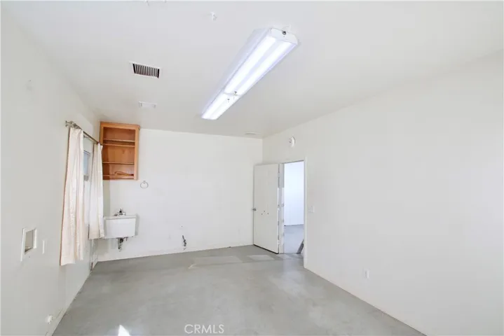 In back garage- permitted as "laundry room", not included in house square footage