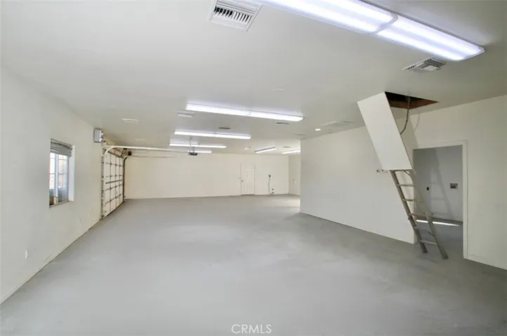 HUGE finished garage with attic storage, "laundry room" and bathroom