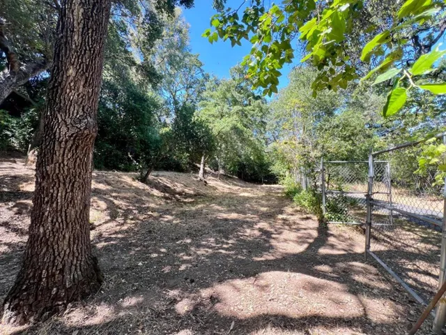 Lower lot w/access from Wild Way, flat useable area to build ADU or split lot and build another home