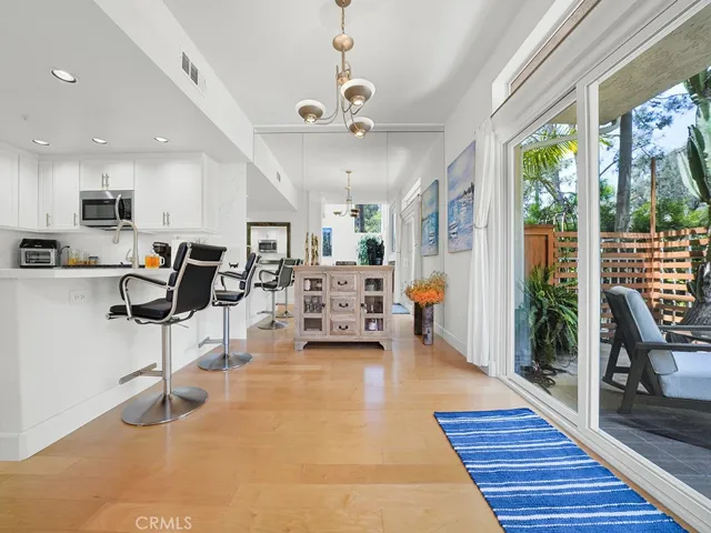 The dining room is adjacent to the kitchen and living room.