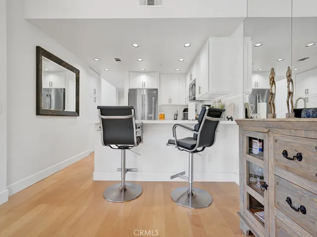 The kitchen has a breakfast bar area that is perfect for casual meals.