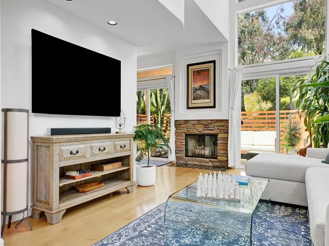 The living room has dual sliding glass doors leading to your private backyard.