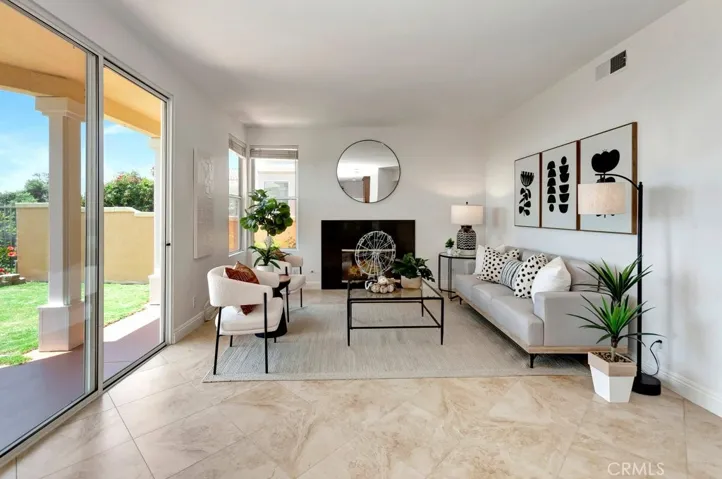 Family Room with Gas Fireplace & Slider Opening to the Backyard