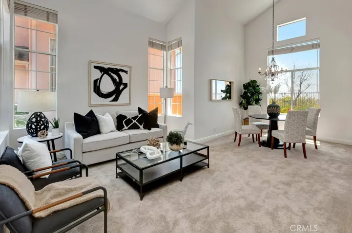 Formal Living Room & Dining Room Areas the Vaulted Ceilings and New Plush Carpeting - Note the Amount of Light