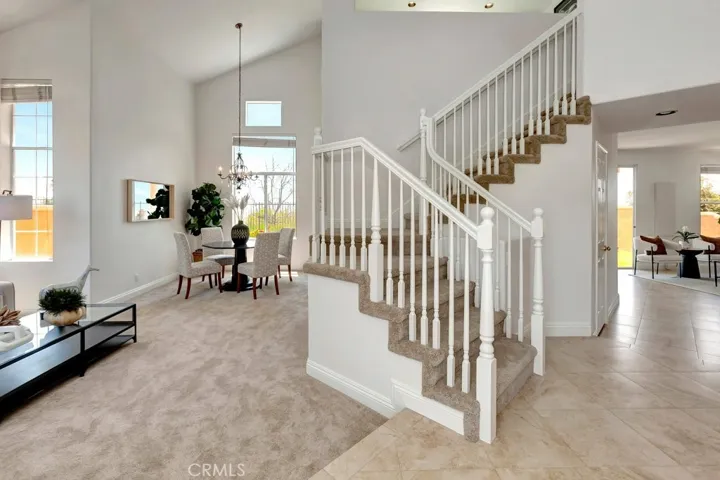 Formal Entry Showing Staircase, New Carpeting & Ceramic Tile Flooring