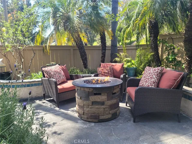 Outdoor patio with fire pit and seating area