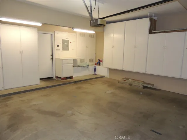 2 car garage with ample storage cabinets