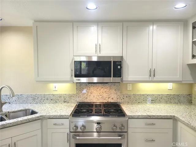 Kitchen has deluxe GE Monogram range