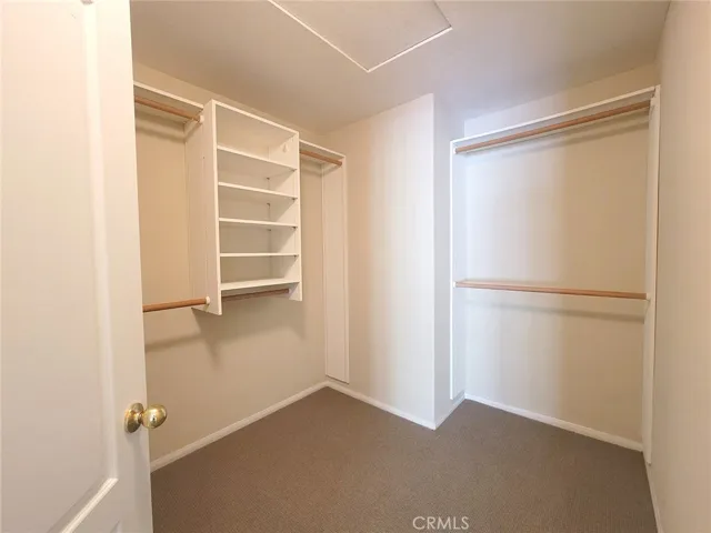 Primary bedroom walk-in closet