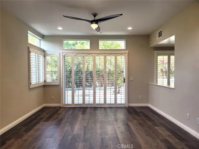 Living room with opening to kitchen and slider to backyard