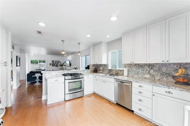Bright kitchen that opens to living/dining room