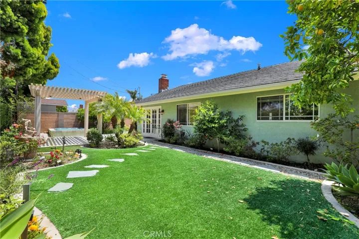 A spacious backyard with astro turf
