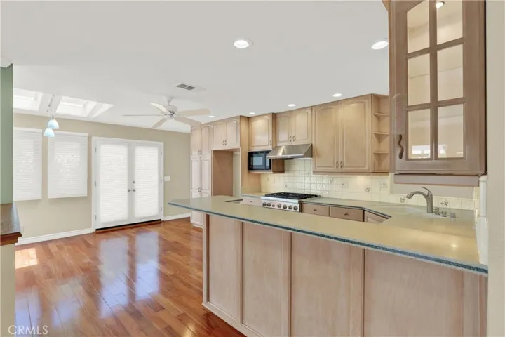 Lots of natural light and recessed lighting in the kitchen
