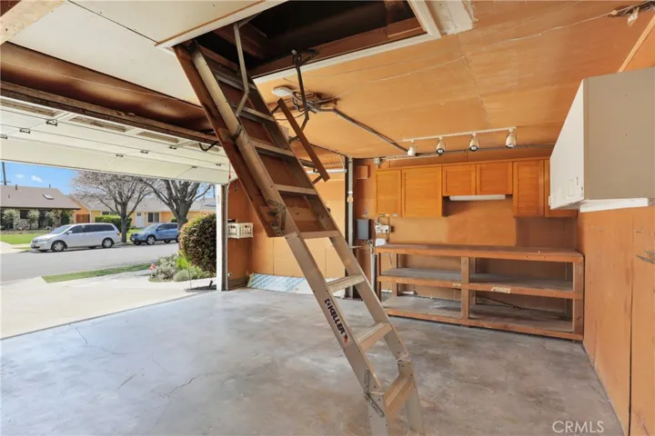 Lots of attic storage in the garage with a pull down ladder for easy access
