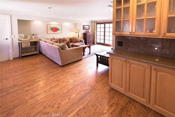 Family Room with additional built-in pantry storage. Family Room has direct access to double garage