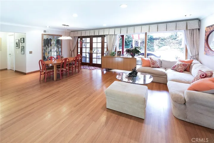 Living Room opens to Dining Area and outside stone patio with pergola