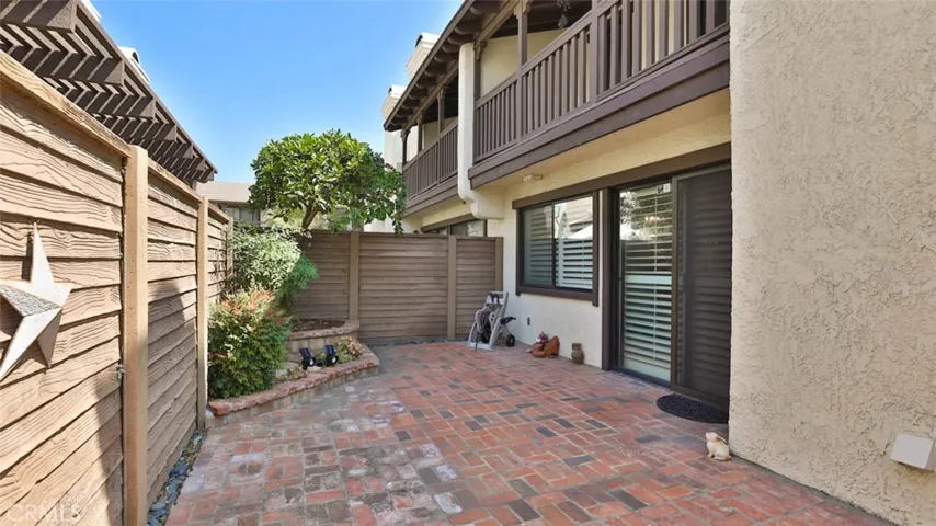 Large custom brick back patio w Meyer lemon tree