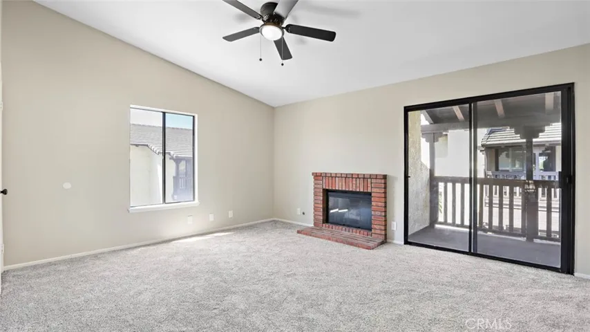 2nd master suites with customer brick fireplace, balcony, high ceilings, mirrored closet doors, new carpet, fan/light and bath.