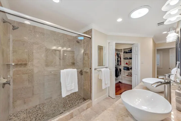 Spacious primary suite bathroom with walk in closet.