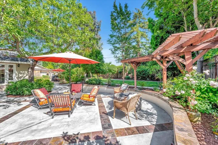 Inlaid slate tile, seat wall, grassy area for play!
