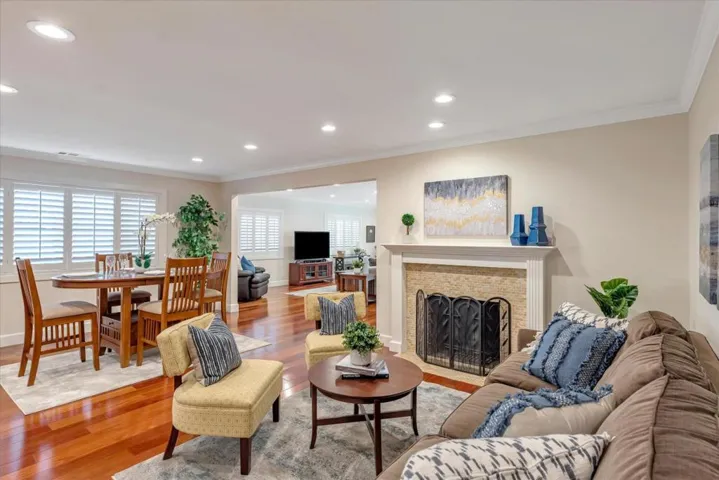 Living room opens to the dining space, kitchen and family room.