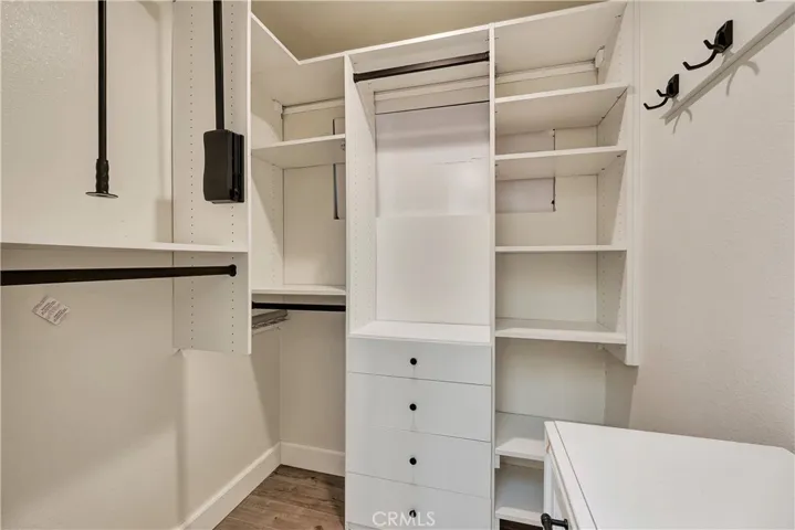 Primary Walk-in Closet by California Closets