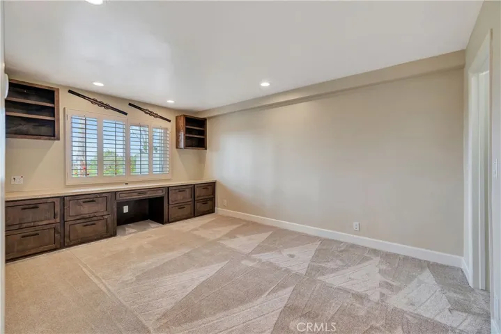 Bedroom with Built-in Desk and Cabinets