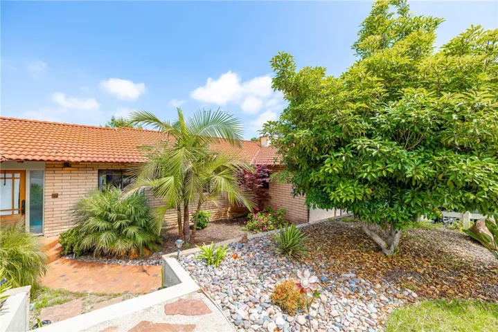 Stairs lead to a court yard at the front of the home, but can access from driveway