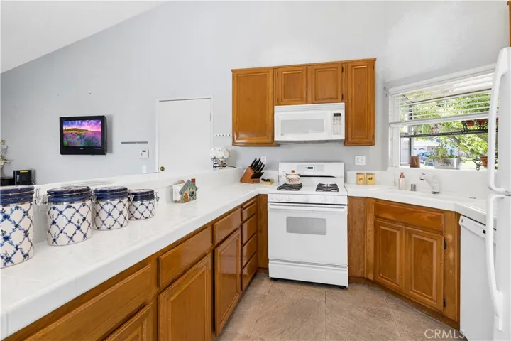 Kitchen with Bay Window, Vaulted Ceiling & Garage Access