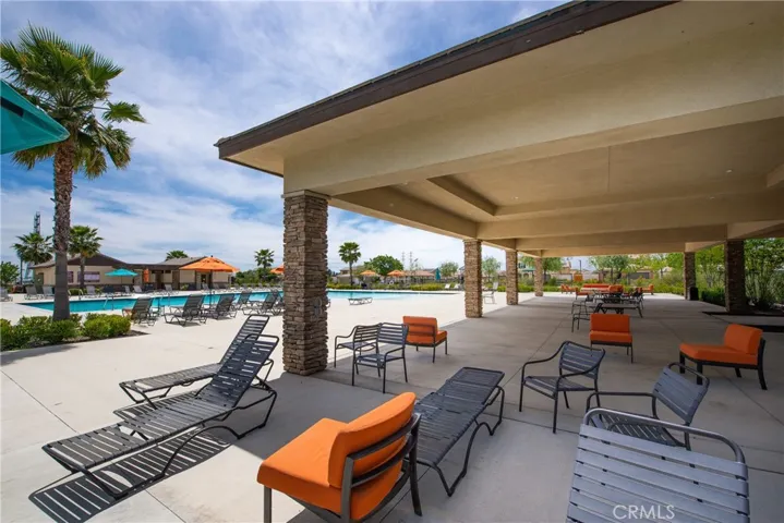 There is plenty of well maintained seating in the pool area. The firepit is at the other end of the patio.