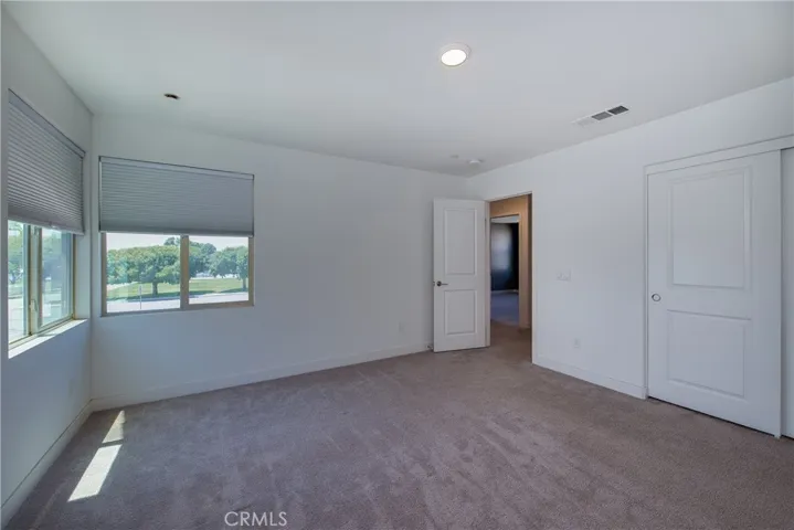 The large windows in Bedroom 5 keep the natural light flowing.