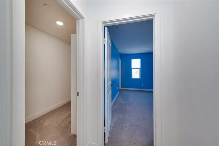 Bedroom 3 is at the top of the stairs and next to a large walk in storage closet.