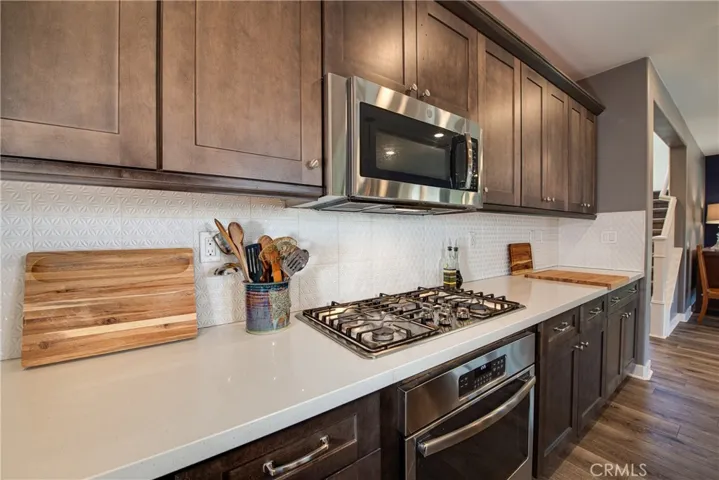 The five burner gas stove top, built in oven and microwave will please any chef.