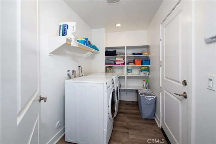 The laundry room is downstairs next to the garage entrance and has plenty of storage for the essentials.