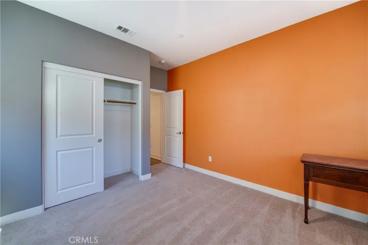 Bedroom 2 is downstairs and overlooks the front yard.