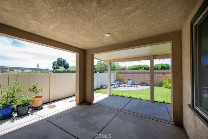 Relax at the end of your busy day on the covered patio in the backyard.
