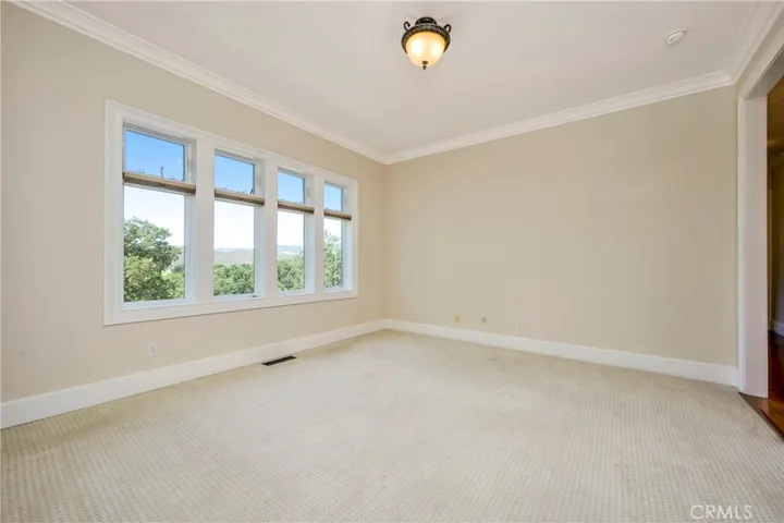 Formal living room with windows to capture the views