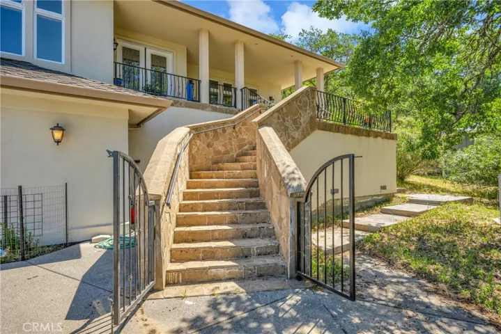 Beautiful stone staircase leading to front door