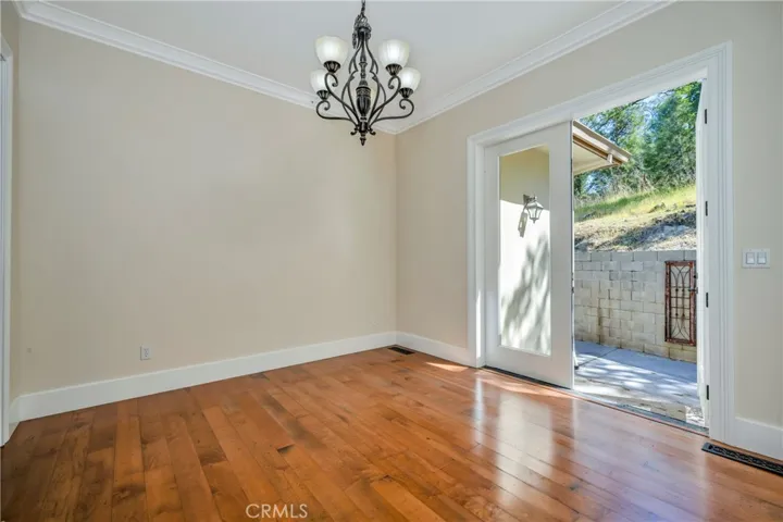 Formal dining with French doors leading to back patio