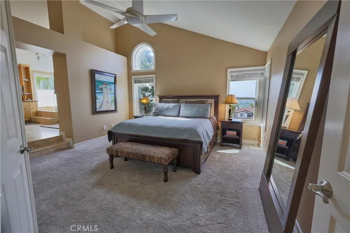 Primary bedroom is spacious with step up to the expansive bath.