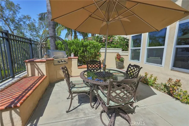 Backyard has built-in BBQ with seating for added outside enjoyment.