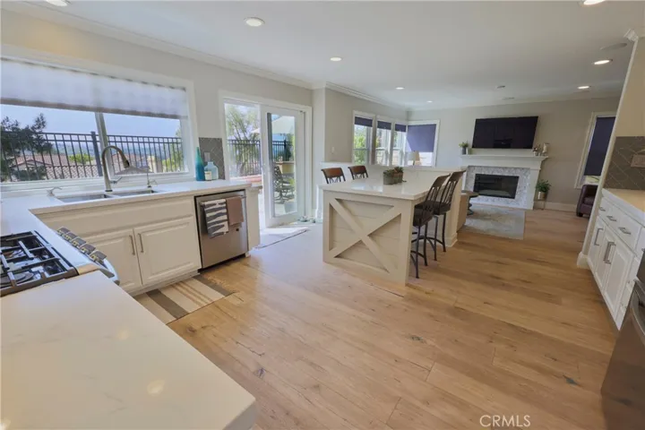Stainless appliances, soft close cabinets and seating island make this kitchen pop.