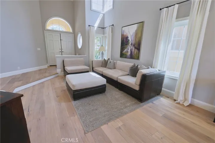 Step down living room with expansive windows giving lots of natural light