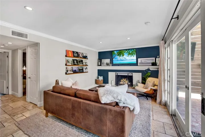 Family Room adorned with Travertine Flooring