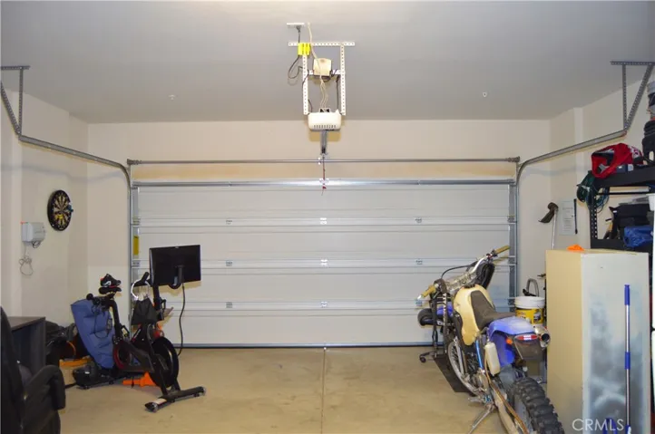 2-car garage with access to the backyard on the side